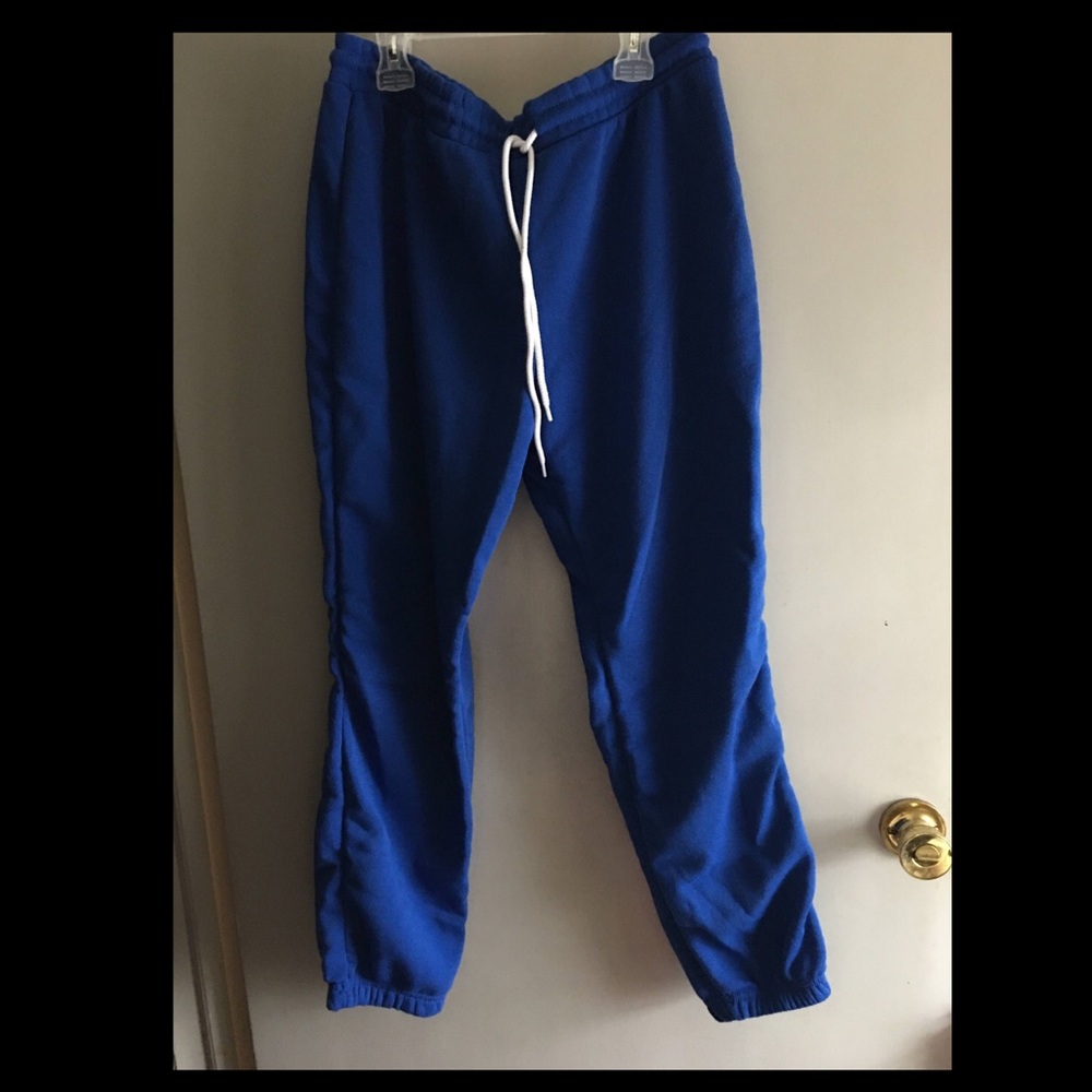 Blue sweatpants .